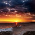 sunset-ocean-colorful-rocks
