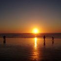 sunset-ocean-family-shore